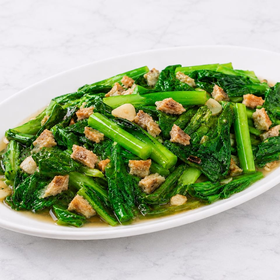 Salted fish with Chinese broccoli stir-fried in garlic sauce.